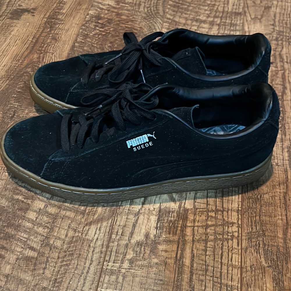 Black suede Puma sneakers